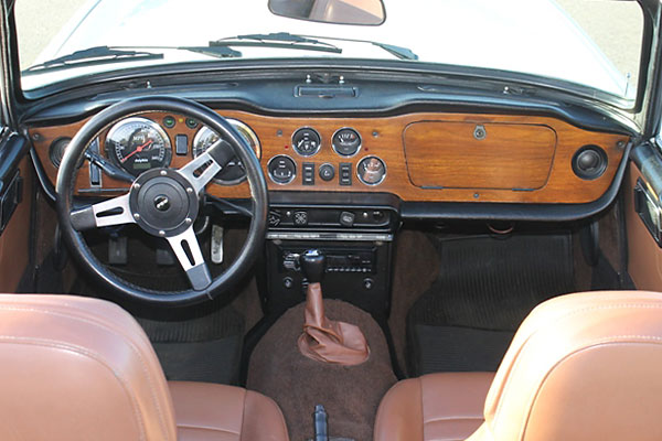 Mountney steering wheel. Dolphin electronic tachometer and speedometer.