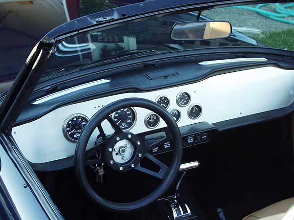 Stewart Warner gauges in a custom aluminum dashboard