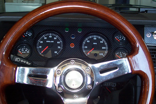 Custom instrument cluster featuring VDO gauges.