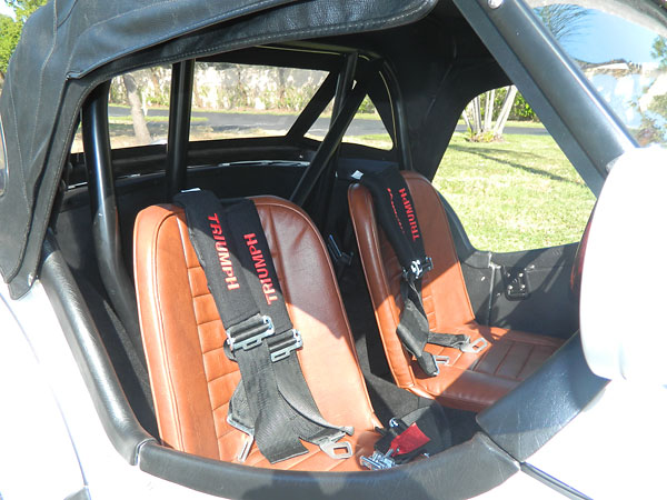 Custom fabricated aluminum seats, covered in vinyl by a local upholstery shop.