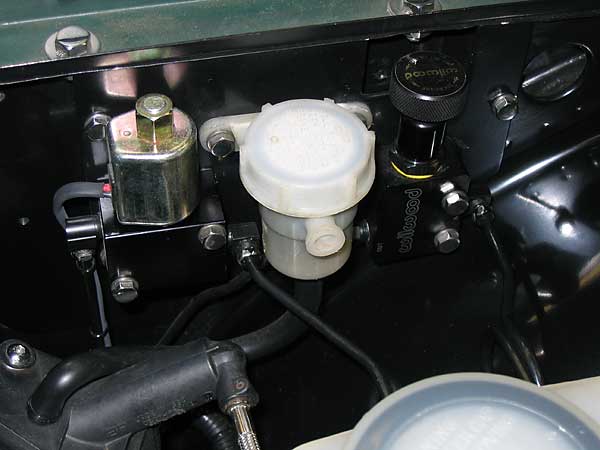 Line lock solenoid, clutch fluid reservoir, and brake proportioning valve