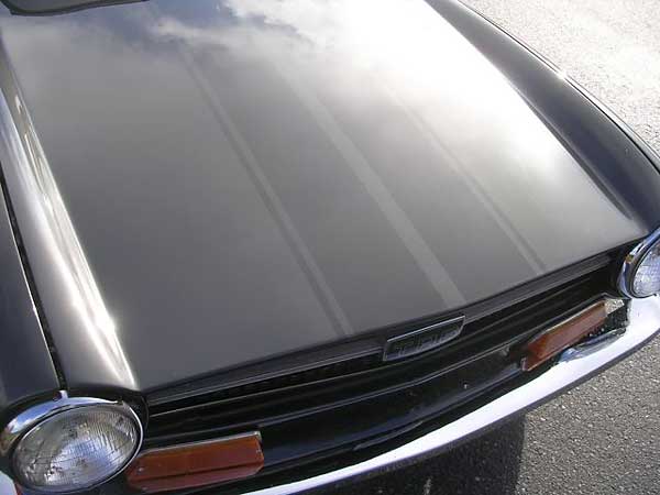 Triumph TR-6 hood with subtle racing stripes