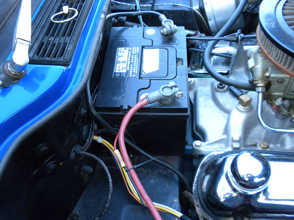 Battery remains in the stock position, on an unmodified battery shelf.