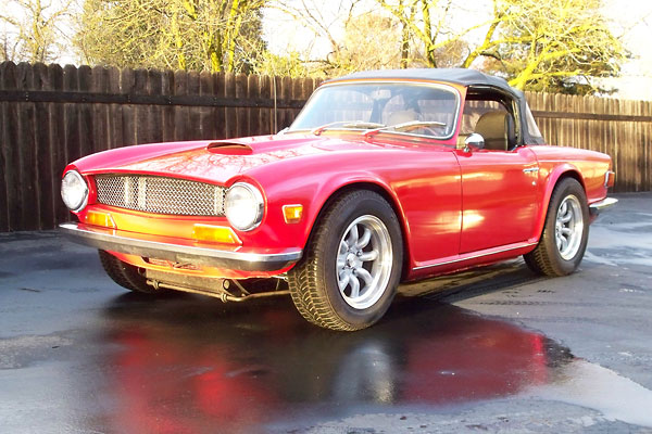 subtle hood scoop, and Minilite-replica wheels