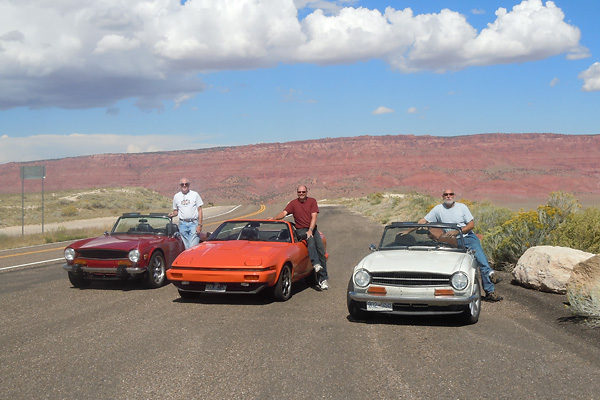 Dave Renner and his orange Triumph TR-7. Bill Sinclair and his white Triumph TR-6.