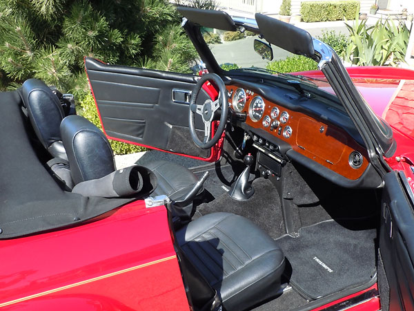 Custom door trim panels featuring MGB interior door pulls.