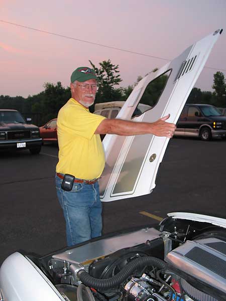 hood pins hold down the lightweight fiberglass hood